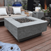 Elementi Manhattan Square Concrete Fire Pit Table OFG103 with no flame, with Square Propane Tank Cover on a Deck Outdoor Set up