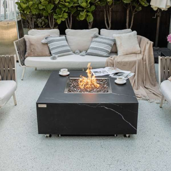 Elementi Plus Sofia Marble Porcelain Fire Table OFP103BB with Flames In Backyard Set Up