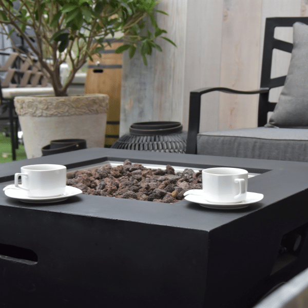 Modeno Aurora Black Square Concrete Fire Pit Table OFG114 No Flame, Coffee Cups on an Outdoor Set Up Close Up VIew of Burner