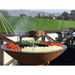 Arteflame Classic 40 Inch Grill Tall Base With Grilled Spices Around And A Grilled Beef On Top Of The An Arteflame Grate Riser