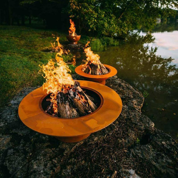     Fire Pit Art Magnum Wood Burning Fire Pits With Flame On The Riverside