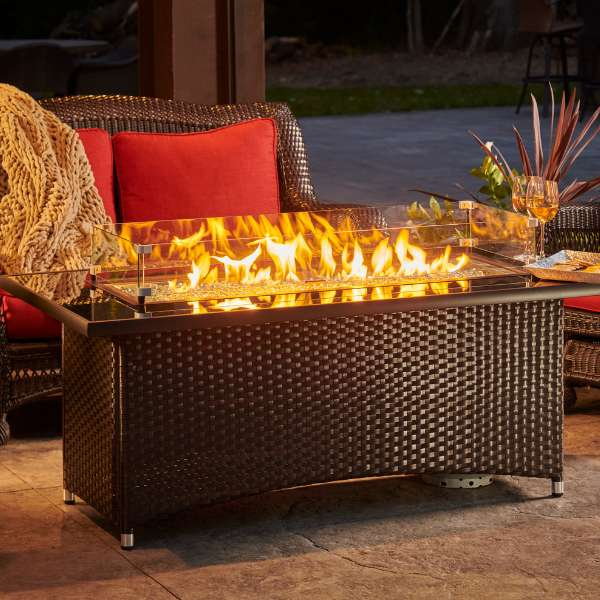     The Outdoor Greatroom Balsam Montego Linear Gas Fire Pit Table With Flame And Windscreen In A Garden Setup