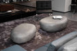 https://cdn.shopify.com/s/files/1/0100/7917/4734/files/Elementi-Home-Hawaii-48-Large-Moon-Grey-Concrete-Pebble-Table-4.jpg?v=1739825853