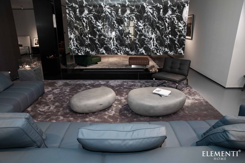 https://cdn.shopify.com/s/files/1/0100/7917/4734/files/Elementi-Home-Hawaii-48-Large-Moon-Grey-Concrete-Pebble-Table-7.jpg?v=1739825879