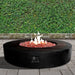 Stonelum Coliseo 02 Concrete Round Fire Pit Black in Vertical Garden Background
