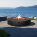 Stonelum Coliseo 02 Concrete Round Fire Pit Black in Patio by the Beach