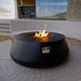 Stonelum Indiana Modern Fire Pit 03 black with fire on a patio