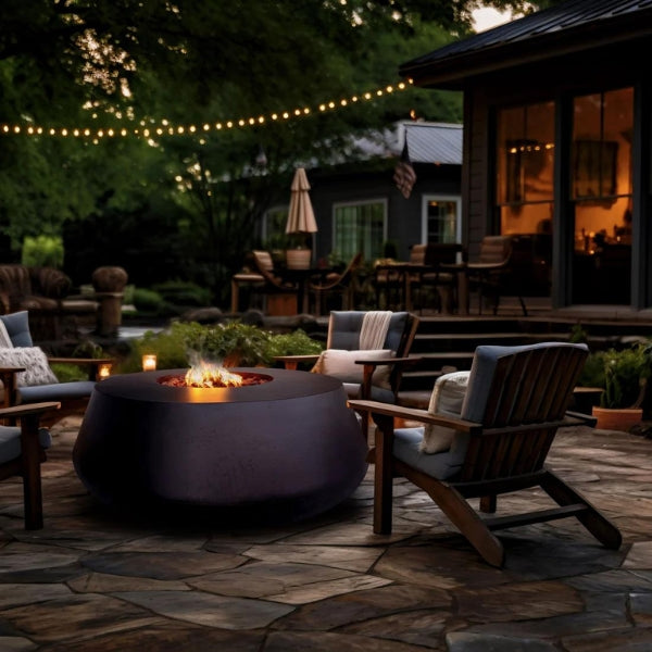 Stonelum Indiana Modern Fire Pit 03 black with fire on a nice backyard with evening lights
