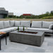 Stonelum Manhattan 01 Rectangular Concrete Fire Pit grey with sofa wine glass and bottle in a backyard setting