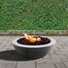 Stonelum Venicia 02 Concrete Fire Bowl natural concrete with fire on green background
