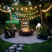 Stoneulm Venecia 06 Concrete Fire Bowl Noir in Garden Patio Set Up With Adirondack Chairs Fairy Lights