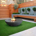 Stonelum Venecia 07 Concrete Fire Bowl Graphite in Backyard with Wooden Plank Seats