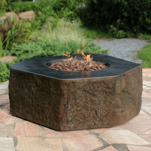 Round fire pit table on outdoor patio with seating arrangement