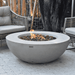 Elementi Lunar Round Concrete Fire Pit Table OFG101 Actual Photo Up Close With Flame, Accent Chair on an Outdoor Set Up