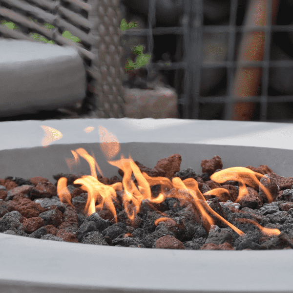 Elementi Lunar Round Concrete Fire Pit Table OFG101 Up Close Photo of Flame and Lava Rocks