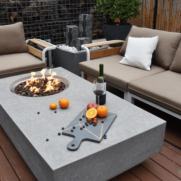Elementi Metropolis Rectangle Concrete Fire Pit Table OFG104 With Flame, Wine, Fruits, Spacious Coffee Table, Couch on Deck Set Up