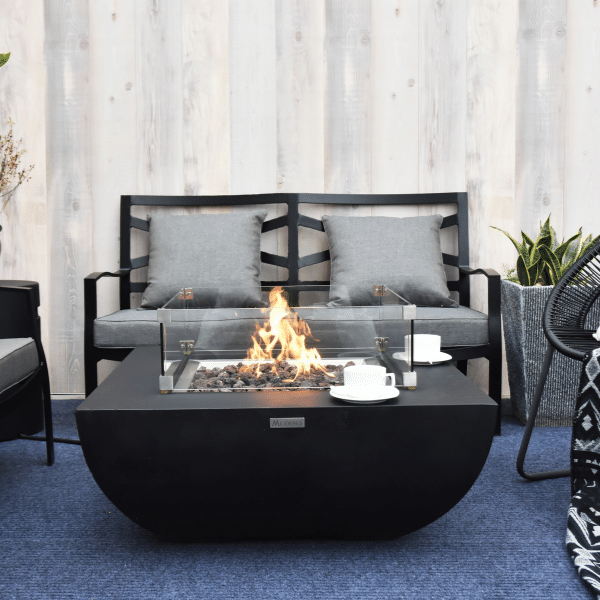 Modeno Aurora Black Square Concrete Fire Pit Table OFG114 With Flame, Windscreen, Coffee Cups on an Outdoor Set Up