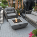 Modeno Westport Square Concrete Fire Pit Table OFG135 With Flame, Accent Chairs, On Patio Backyard Set Up