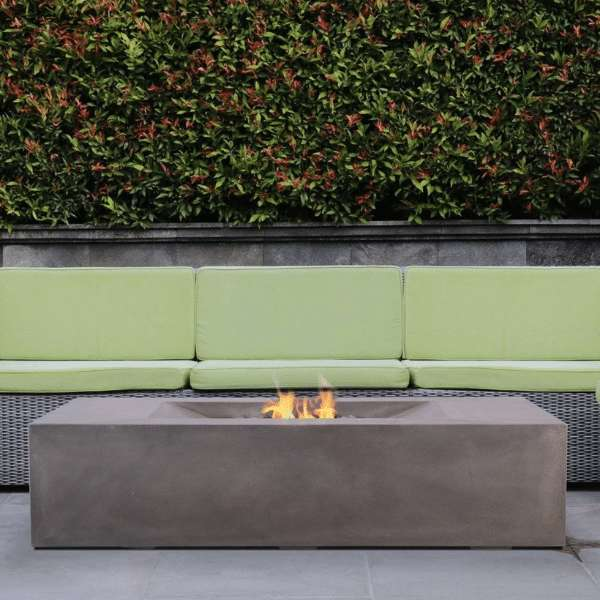 PyroMania Fire Moderne Rectangle Concrete Commercial Fire Pit Table Slate Color With Flame on A Backyard Set up