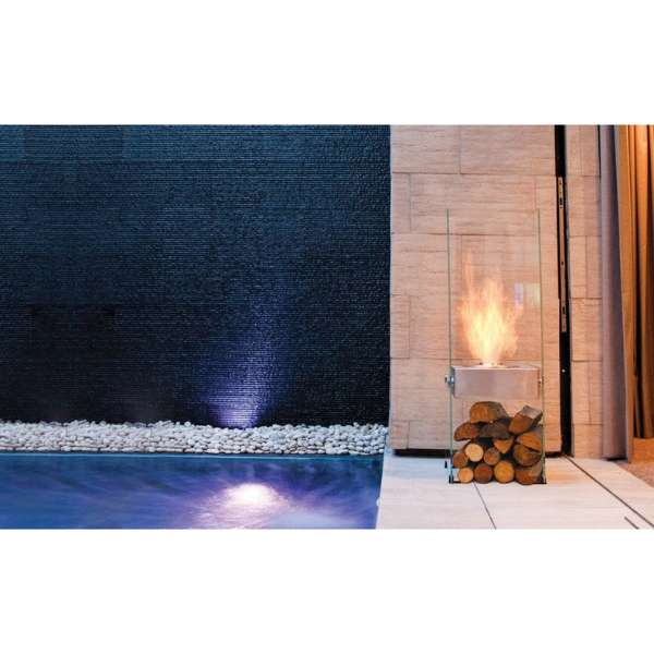 Ecosmart Fire Ghost Designer Fireplace With Logs Under In An Indoor Swimming Pool Set Up