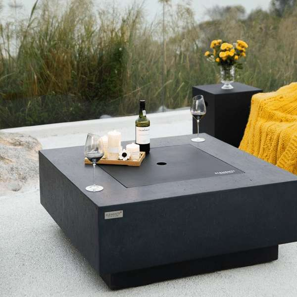 Elementi Plus Bergen Fire Table OFG413DG With Drinks and Canndles On Top of Cover, Propane Tank Cover In Background