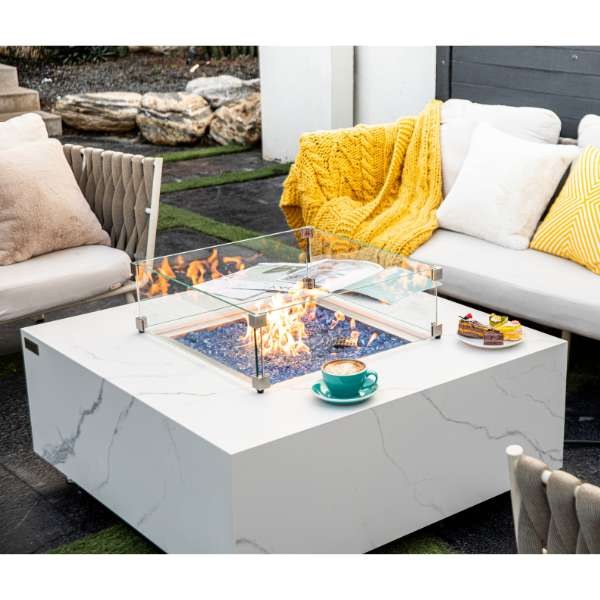 Elementi Plus Bianco White Marble Porcelain Fire Table OFP103BW In Backyard With Flames and Windscreen