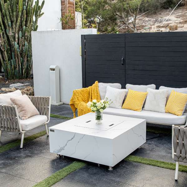 Elementi Plus Bianco White Marble Porcelain Fire Table OFP103BW In Backyard with Cover