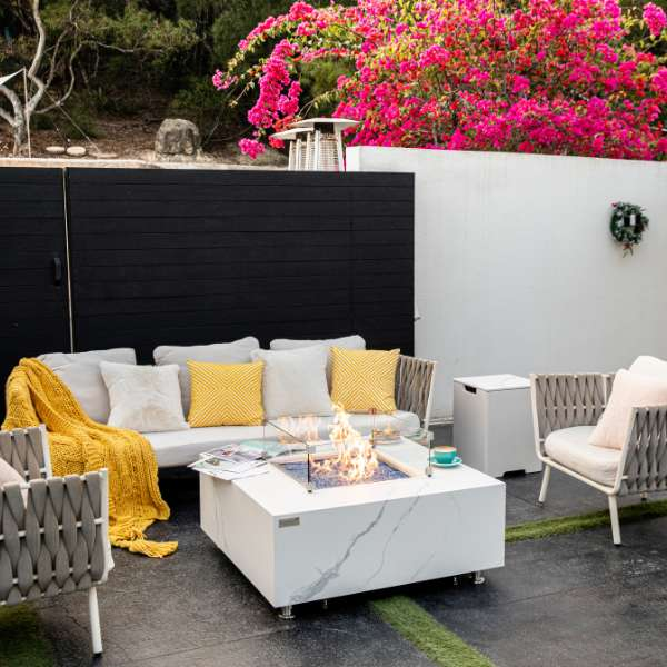 Elementi Plus Bianco White Marble Porcelain Fire Table OFP103BW In Backyard With Flames Windscreen and Tank Cover