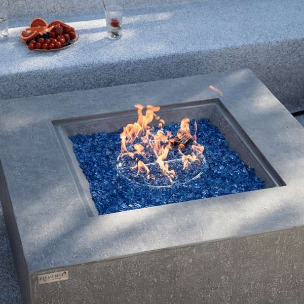 Elementi Plus Victoria Fire Table OFG413LG With Flames on  Blue Fire Glass