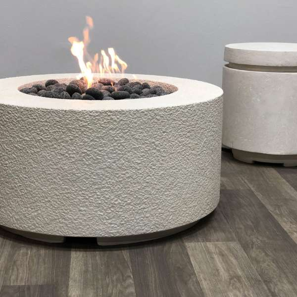 Prism Hardscapes Cilindro Round Gas Fire Pit In An Indoor Set Up With Flame