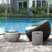 Prism Hardscapes Moderno 3 Concrete Gas Fire Pit In Pewter With Tank Cover And Chair On The Pool Deck