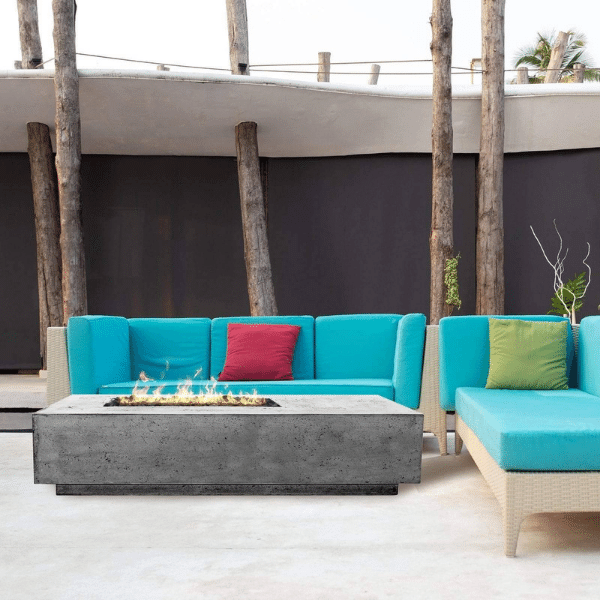 Prism Hardscapes Tavola 5 Concrete Gas Fire Pit In Pewter With Flame On A Deck