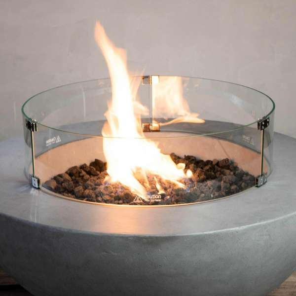     Starfire Designs Beton Round Glass Wind Guard Top View On A Beton Round Fire Pit With Flame On