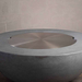 Starfire Designs Beton Round Stainless Steel Burner Cover On A Top Of The Beton Round Fire Pit