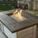 The Outdoor GreatRoom Alcott Rectangular Gas Fire Pit Table ALC-1224 Outdoor Set Up With Flame