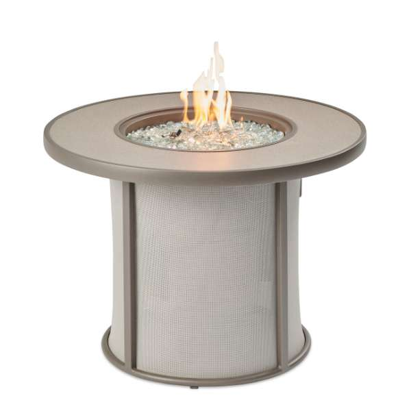 The Outdoor Greatroom Grey Stonefire Round Gas Fire Pit Table With Flame On A White Background