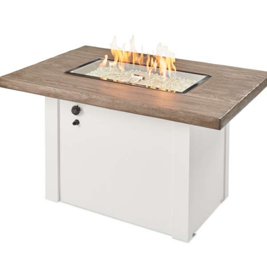 The Outdoor Greatroom Havenwood Rectangular Gas Fire Pit Table In White With Flame On A White Background