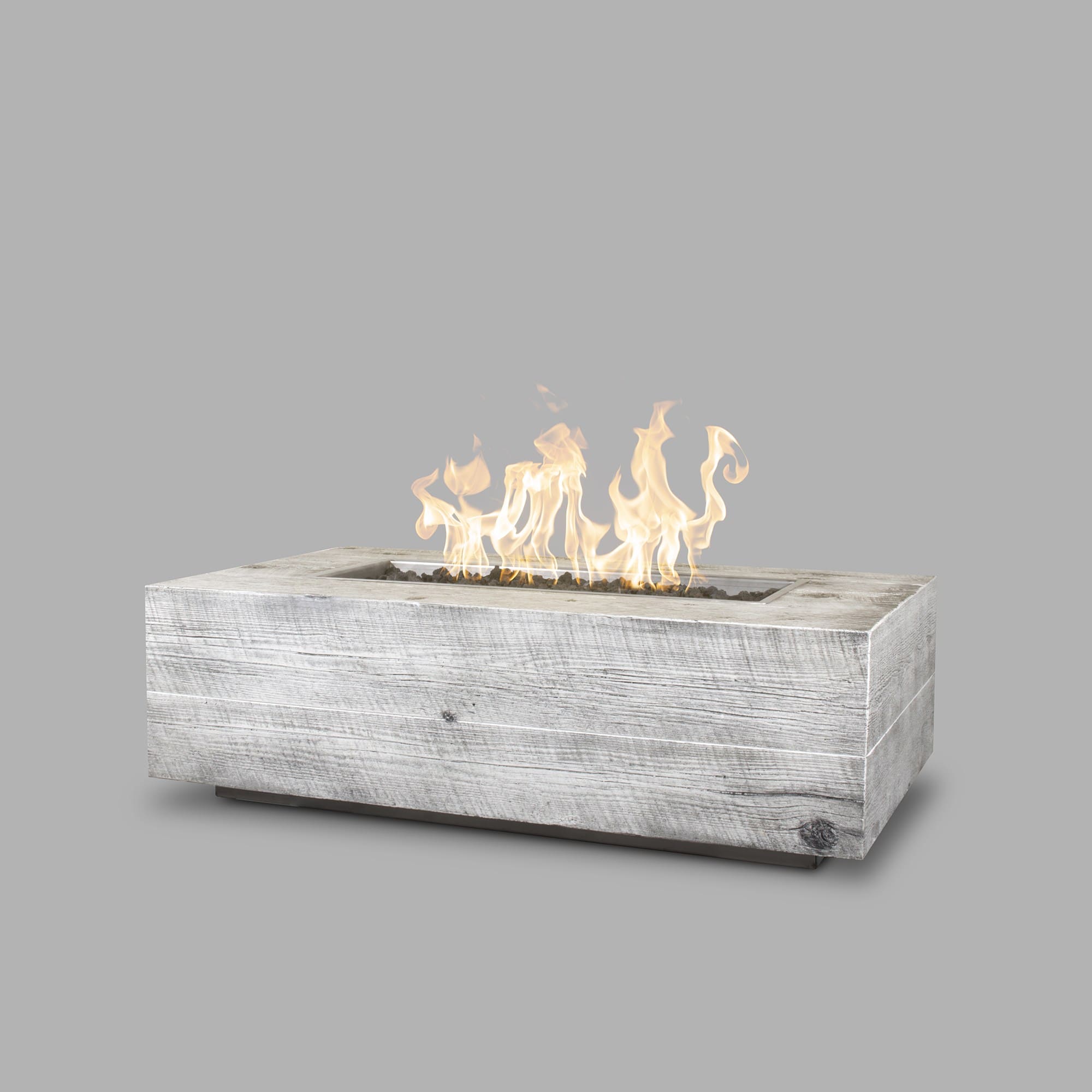 The Outdoor Plus Coronado Wood Grain Fire Pit in Ivorywith flame on white background